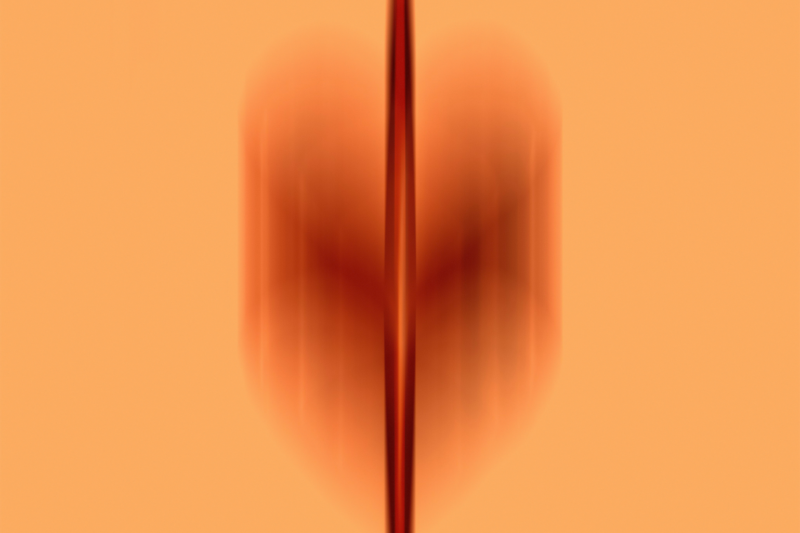 Herzgesundheit Symbolfoto, oranger Hintergrund, rostbrauner verschwommener Farbverlauf